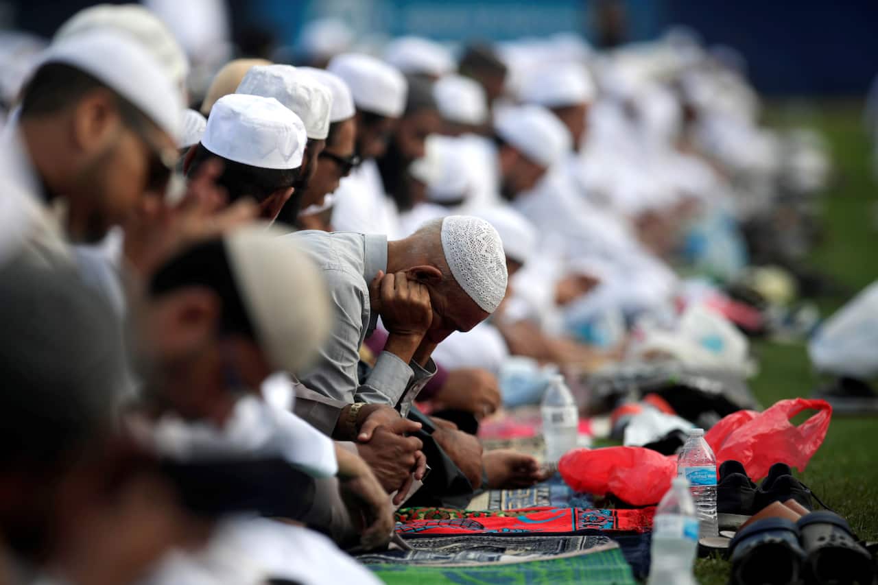 Muslim men and children take part in the Eid al-Fitr prayers, which mark the end of the holy month of Ramadan, in Panama City, Panama.