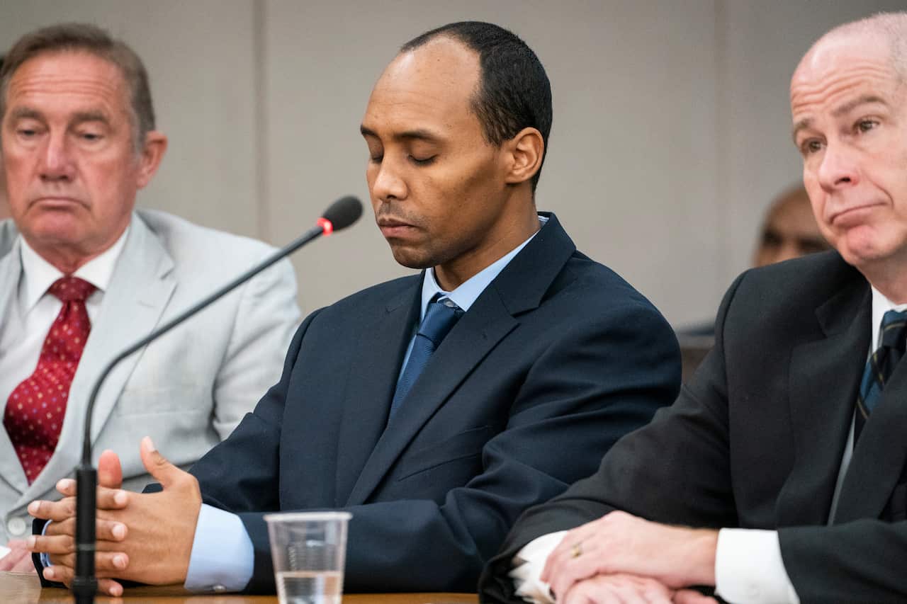 Mohamed Noor (middle) listens to victim impact statements during his sentencing hearing.