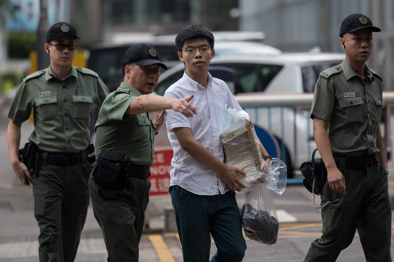 Demosisto Secretary General and pro-democracy activist Joshua Wong is escorted out of the Lai Chi Kok Correctional Institute Hong Kong, China.