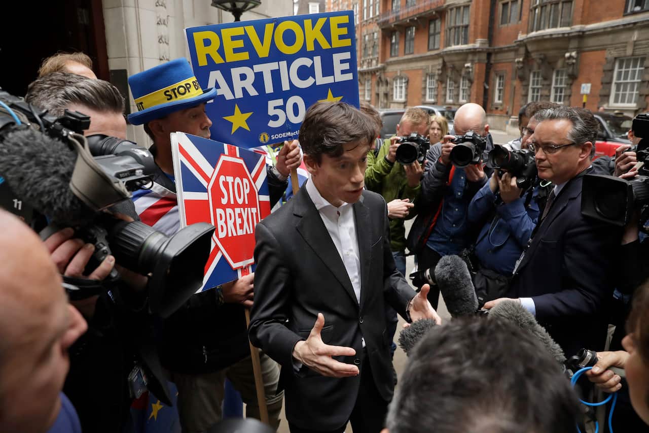 British ruling Conservative party leader contender Rory Stewart speaks to the media as he leaves television news network studios in London.