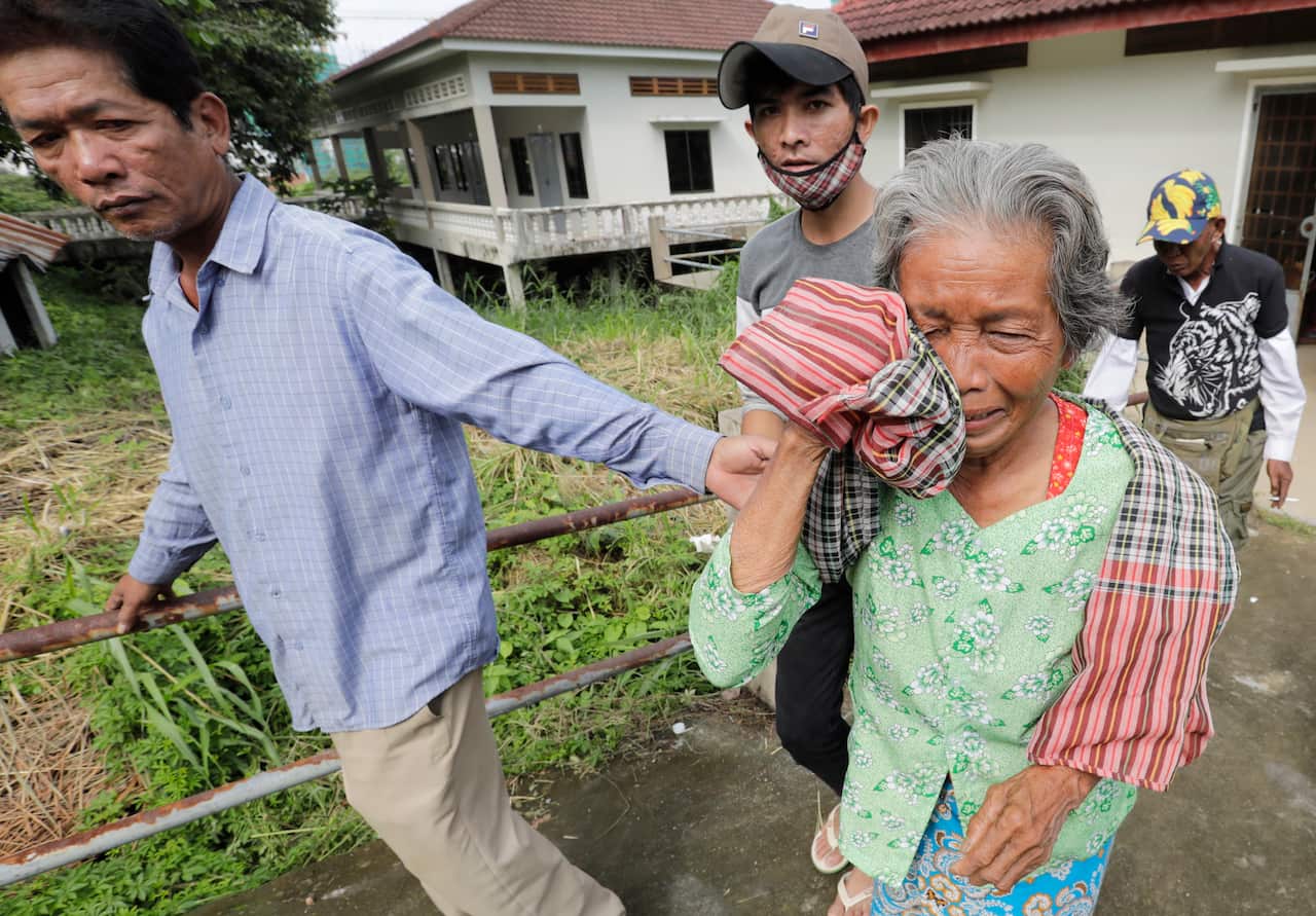 A Cambodian woman sobs after losing her niece in the building collapse.