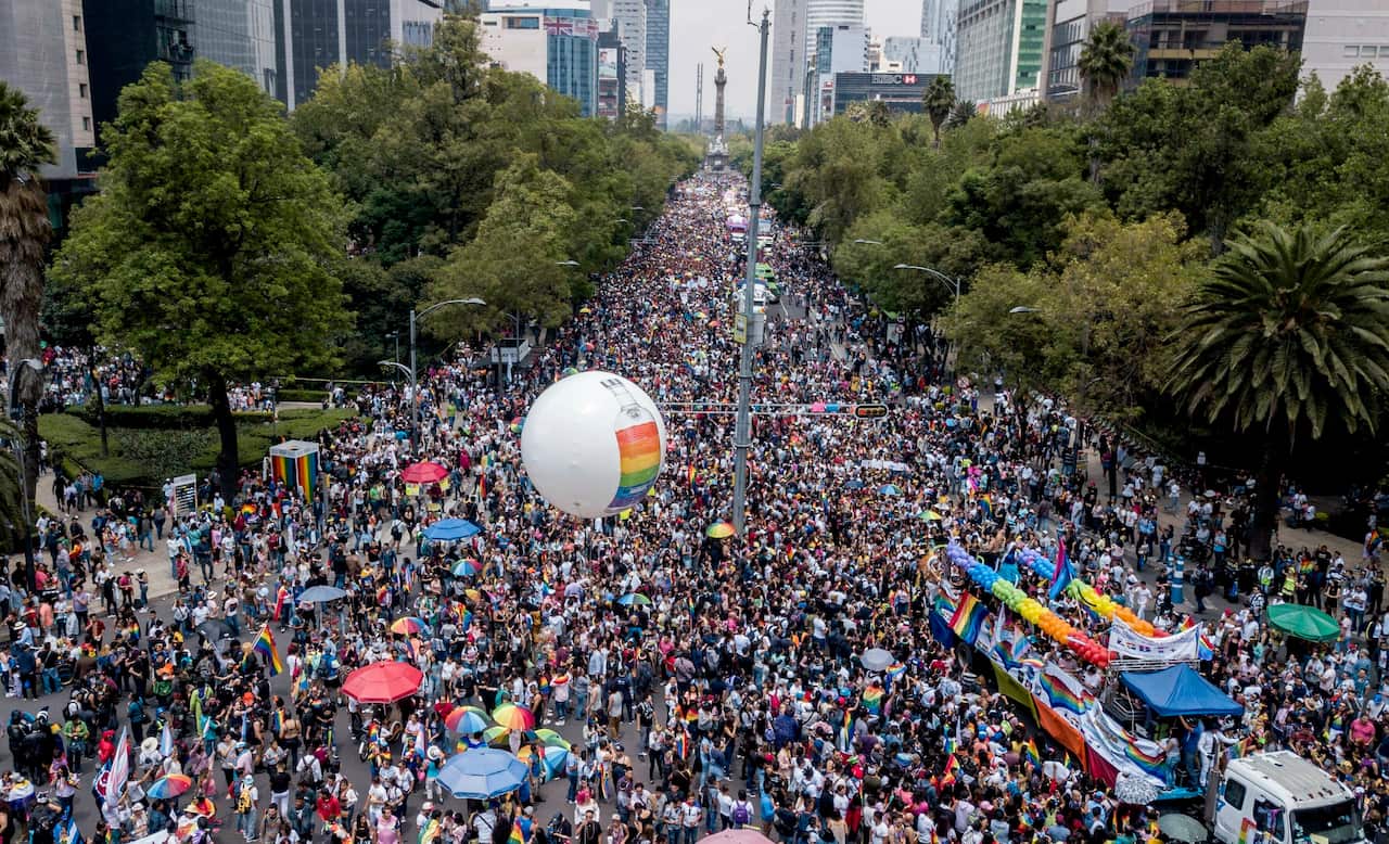 Revelers fill Mexico City's iconic Reforma Avenue during the gay pride parade, Saturday, Jun. 29, 2019. (AP Photo/Christian Palma)