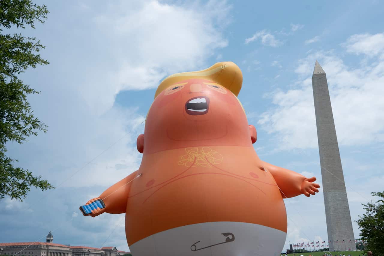 Members of the protest group Code Pink set up the Baby Trump blimp in Washington DC.
