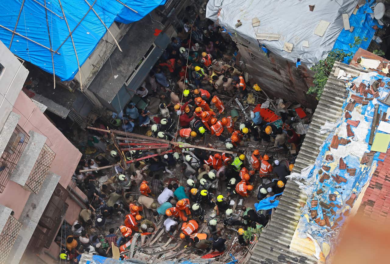 Disaster response force workers have so far rescued five people - including a baby - from the debris.