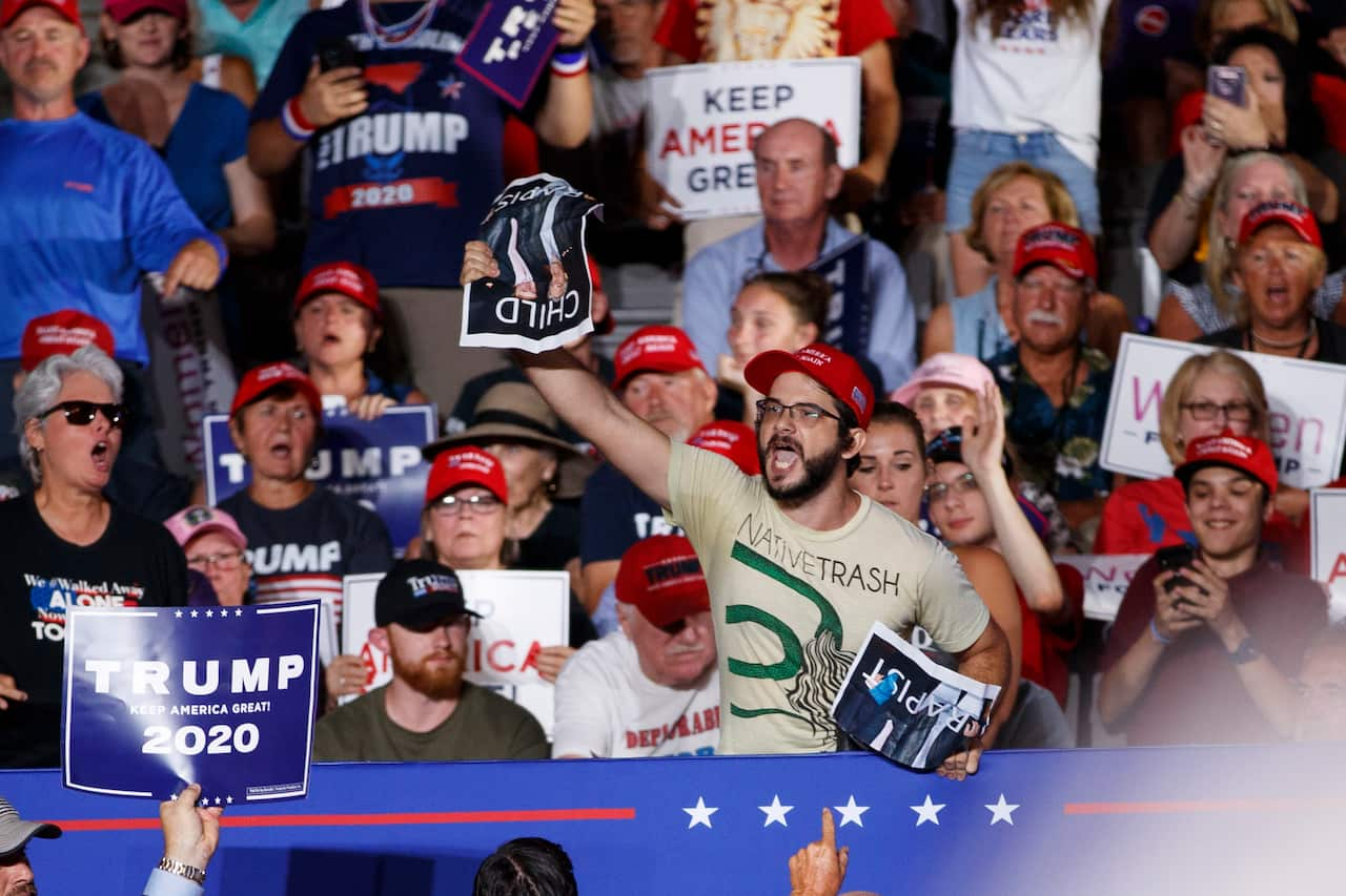 A protester calls out as President Donald Trump speaks at a campaign rally at Williams Arena in Greenville, N.C., Wednesday, July 17, 2019. (AP Photo/Carolyn Kaster)