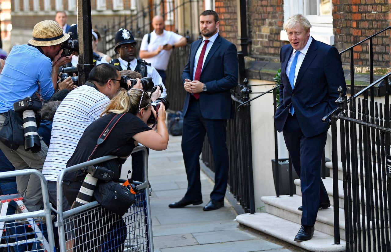 Conservative party leader Boris Johnson departs his office
