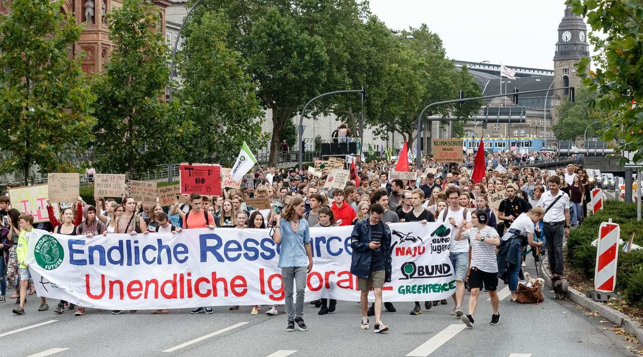 People march in Hamburg on Earth Overshoot Day, July 29.
