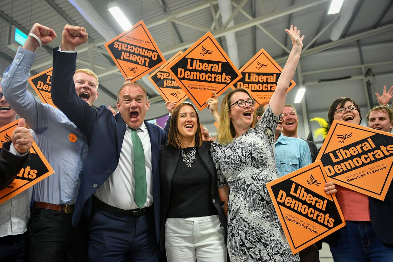 Liberal Democrat MP Jane Dodds, centre, celebrates with supporters as she wins the seat in the Brecon and Radnorshire by-election.