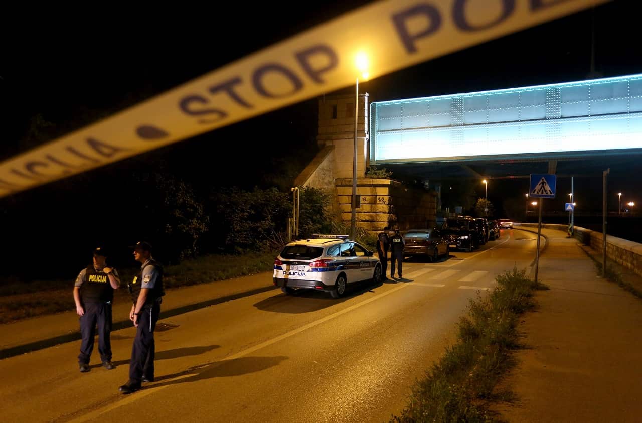 Police inspect the area.