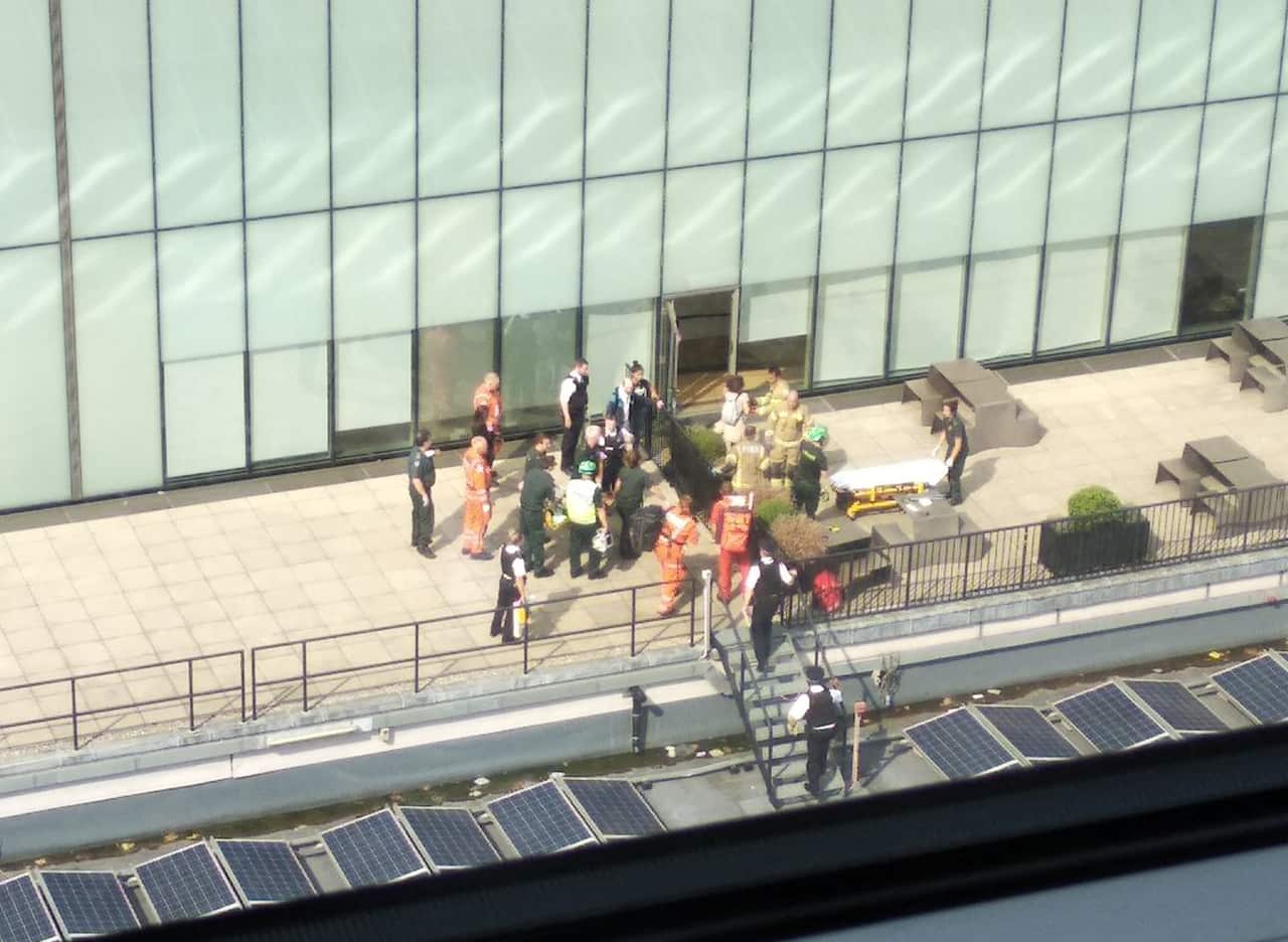 Handout photo from the Twitter feed page of @workofstuart of emergency crews attending a scene at the Tate Modern art gallery