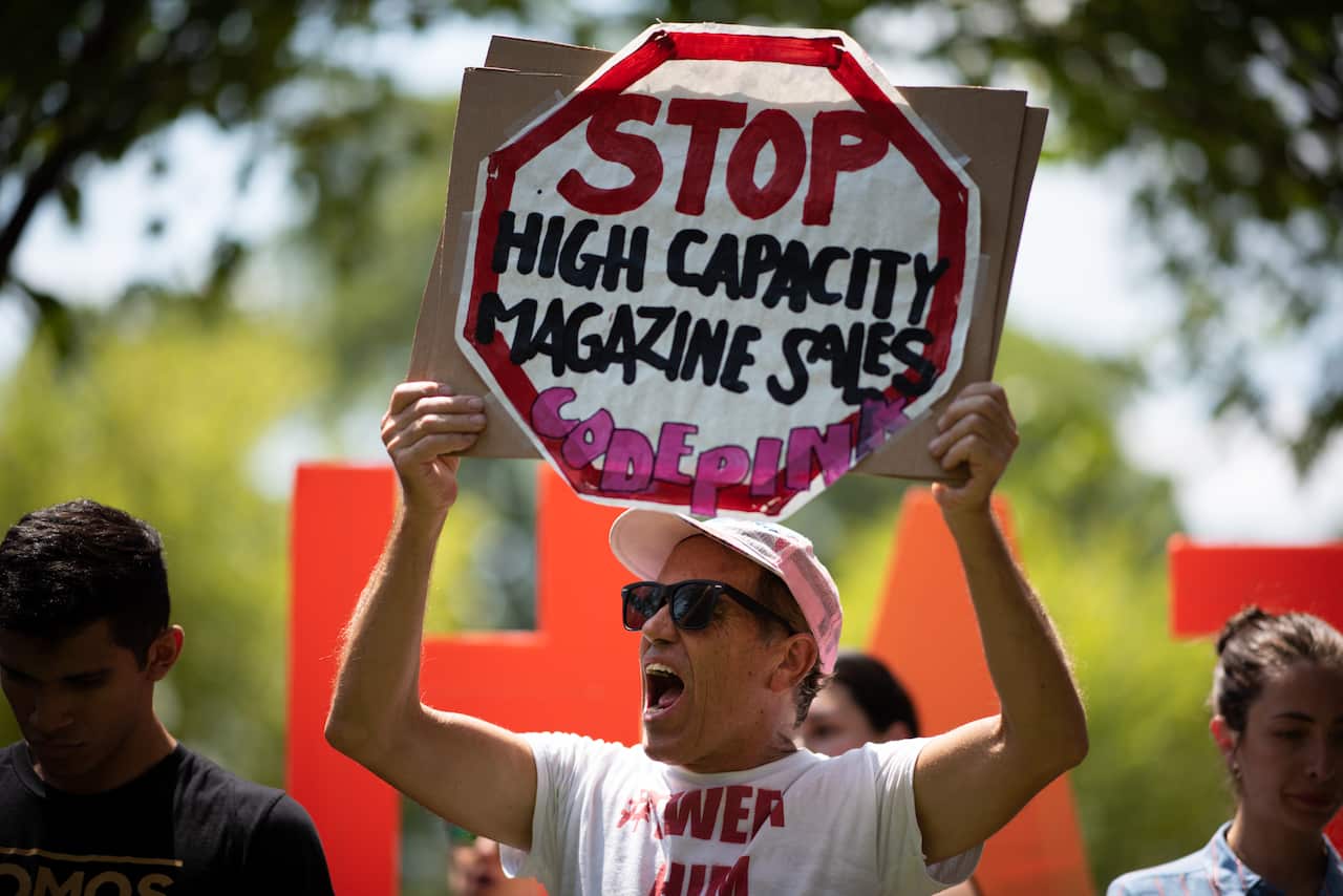 Code Pink protester Tighe Barry takes part in the "Rally against White Supremacy" near the White House on August 6, 2019.
