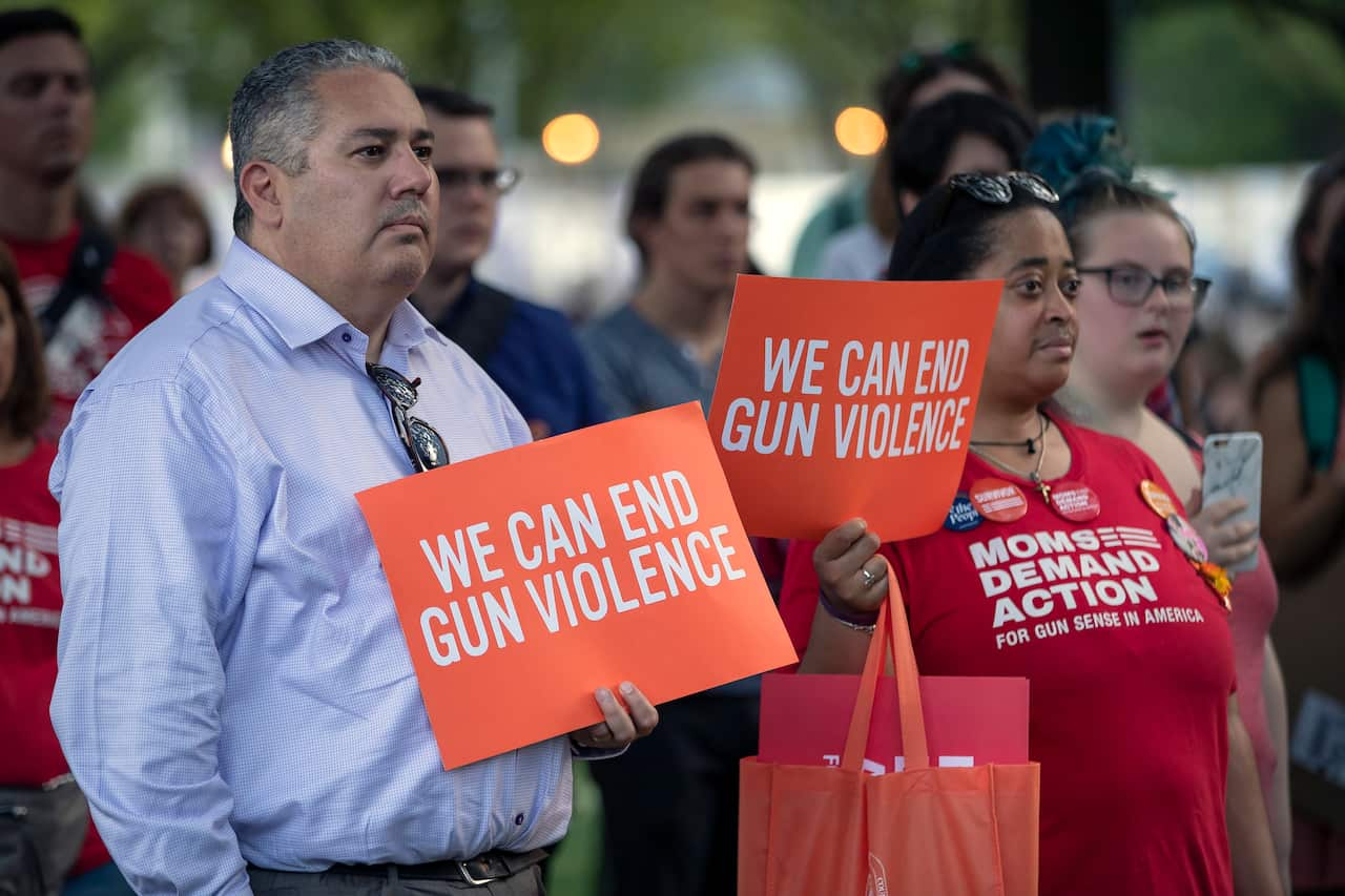 People participate in an anti-gun violence protest at Lafayette Square in Washington, DC