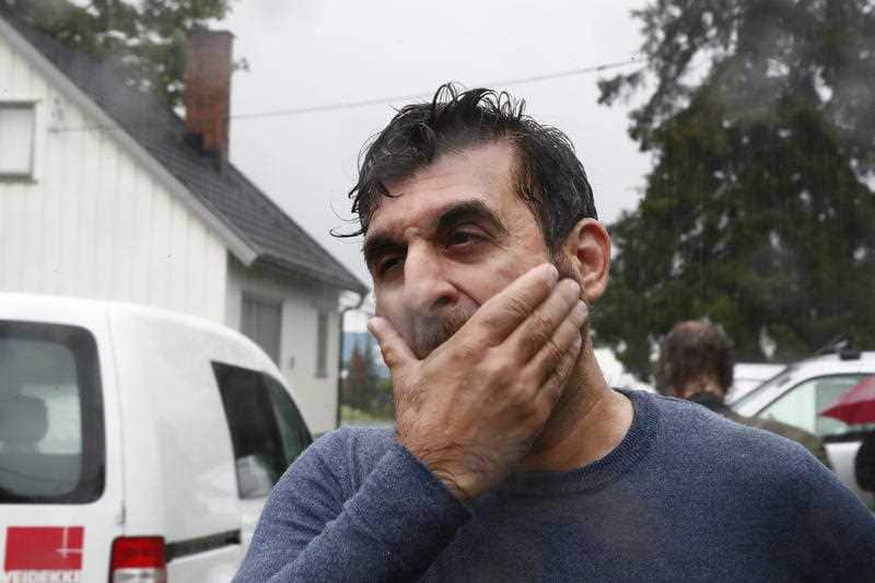 Mosque board member Irfan Mushtaq reacts after one person was shot inside the al-Noor Islamic center mosque