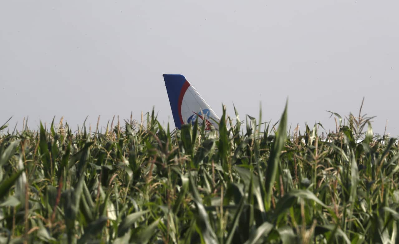 A view of the tail of a Ural Airlines A-321 passenger plane at the site of its emergency landing.