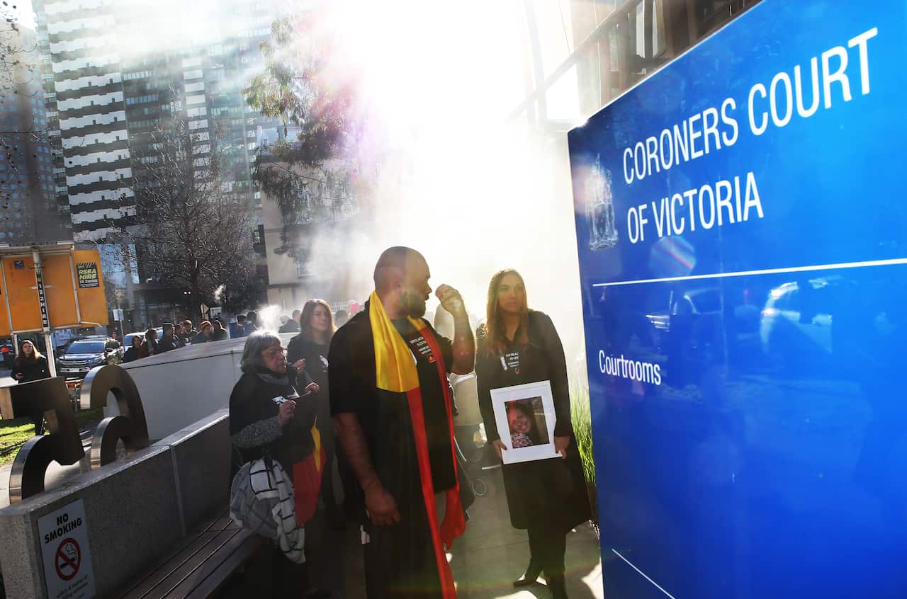 Family members, including Tanya's daughter Apryl Watson (centre), march to the Coroners Court.