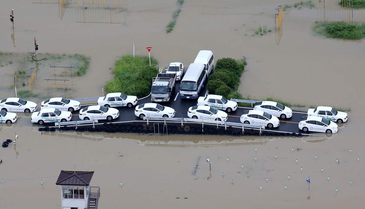 An aerial photo shows a driving school flooded by a heavy rain in Omachi, Saga Prefecture.