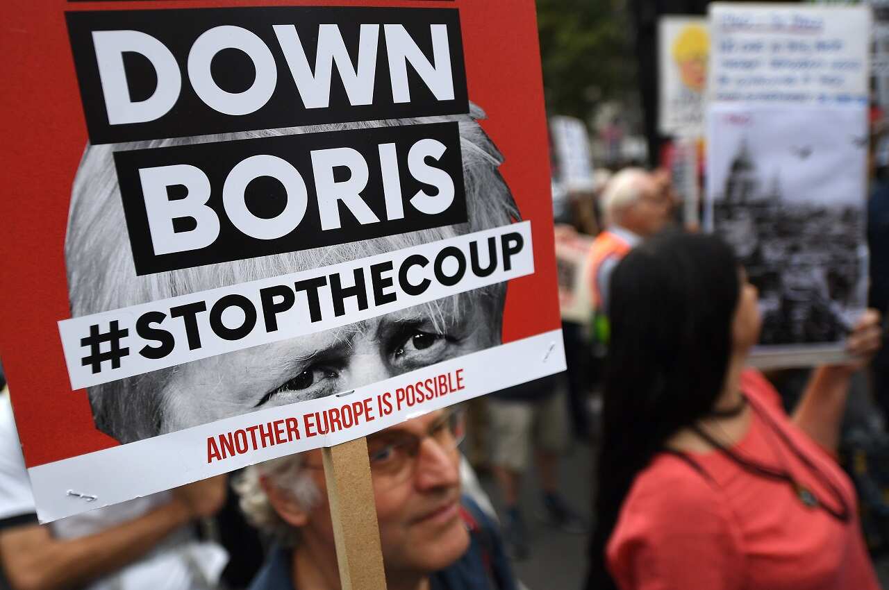 People protest against Boris Johnson in London.