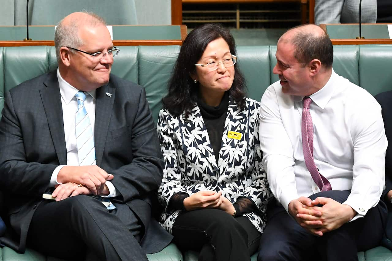 Australian Prime Minister Scott Morrison (left) and Australian Federal Treasurer Josh Frydenberg (right) sit next to Liberal member for Chisholm Gladys Liu.