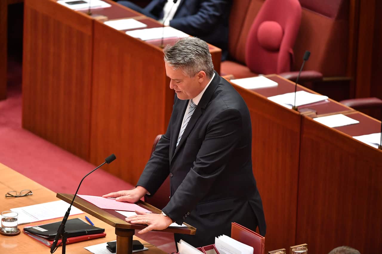 Minister for Finance Mathias Cormann makes a statement on Liberal member for Chisholm Gladys Liu in the Senate chamber at Parliament House in Canberra.