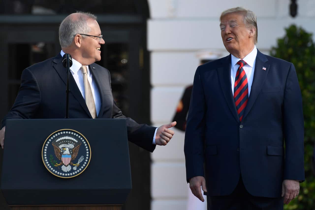 Australian Prime Minister Scott Morrison gestures toward President Donald Trump during a State Arrival Ceremony on the South Lawn of the White House in Washington, Friday, Sept. 20, 2019. (AP Photo/Susan Walsh)