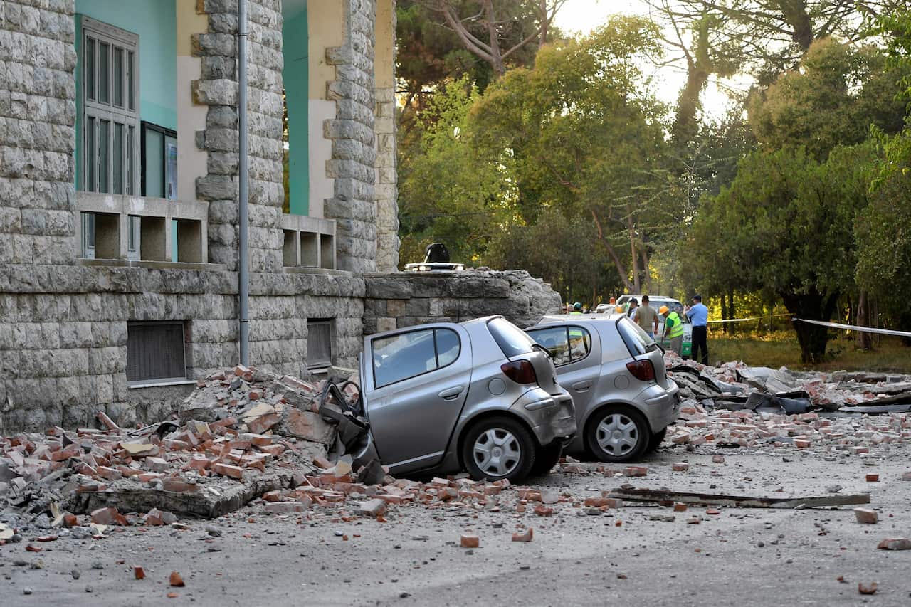 Damaged cars outside the Faculty of Geology building after an earthquake in Tirana.