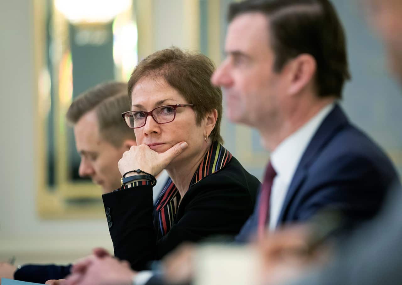FILE - In this March 6, 2019 file photo, then U.S. Ambassador to Ukraine Marie Yovanovitch, center, sits during her meeting with Ukrainian President Petro Poroshenko in Kiev, Ukraine. (Mikhail Palinchak, Presidential Press Service Pool Photo via AP)