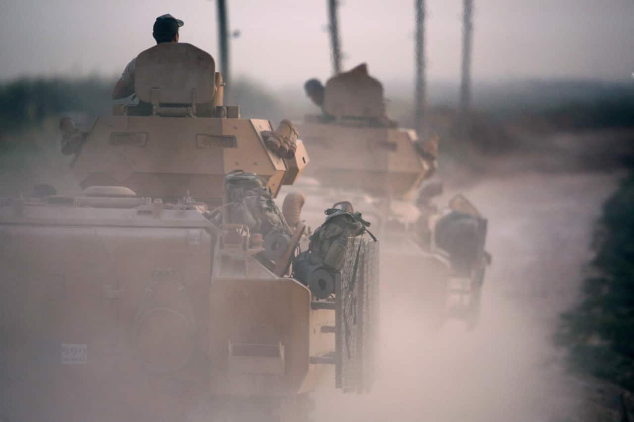 Turkish soldiers with armored vehicles and tanks during a military operation in northern Syria.