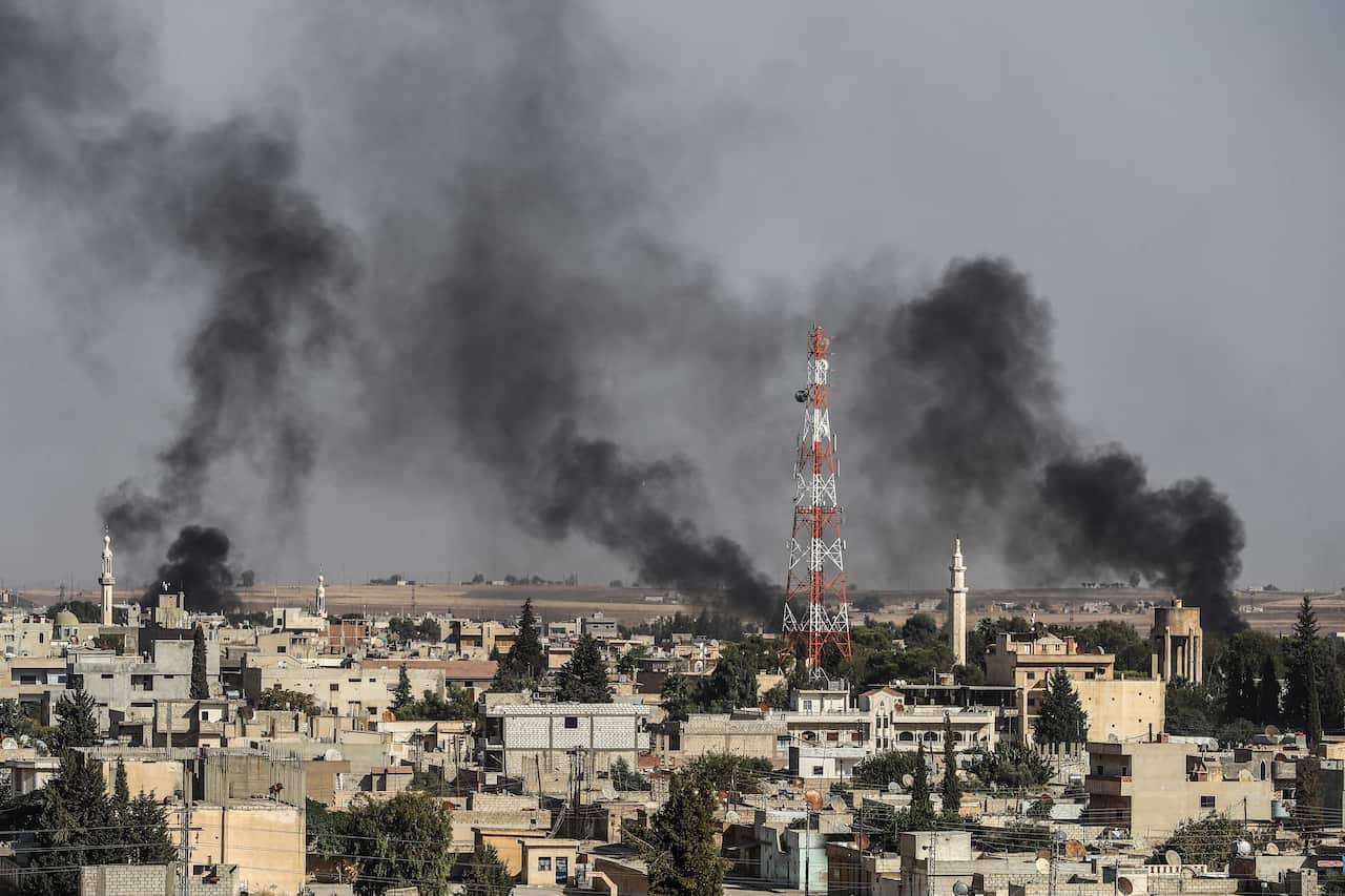Smoke rises from targets inside Syria during a bombardment by Turkish forces at Ras al-Ein this week.