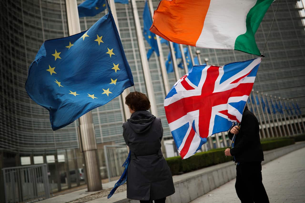 Anti-Brexit protesters wait for the departure of the UK's Stephen Barclay during his meeting with EU chief negotiator Michel Barnier.