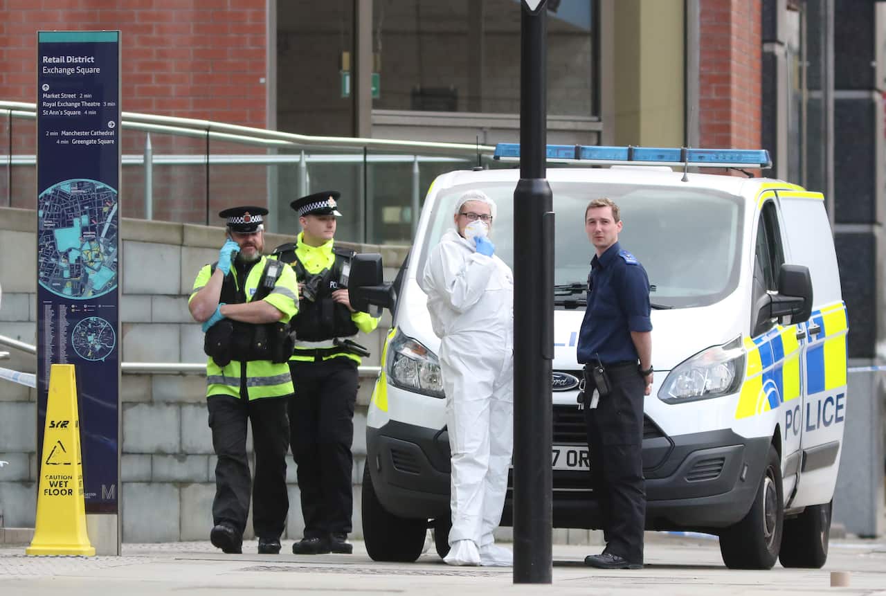 Police and forensic officers outside the Arndale Centre in Manchester where a number of victims have been treated following a stabbing incident.