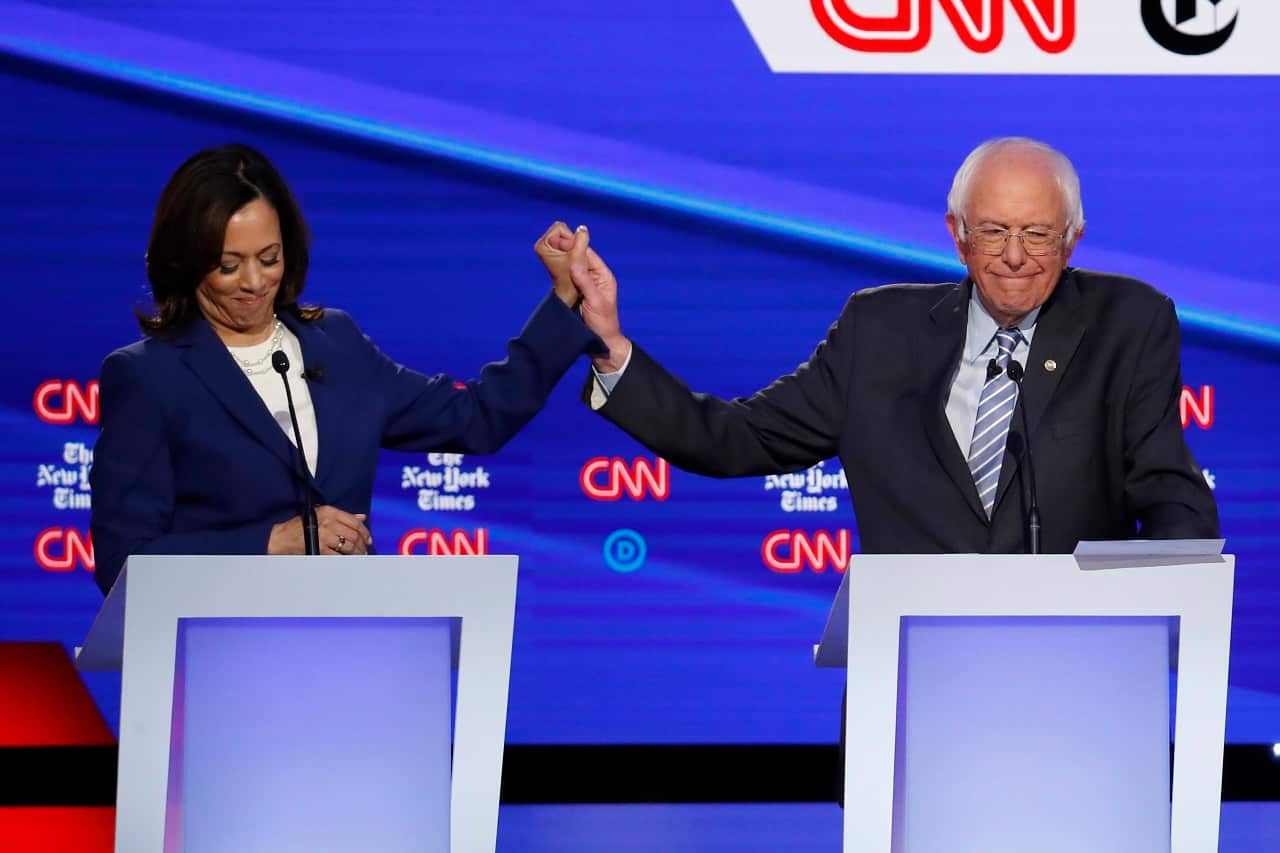 Kamala Harris and Bernie Sanders mid-debate.