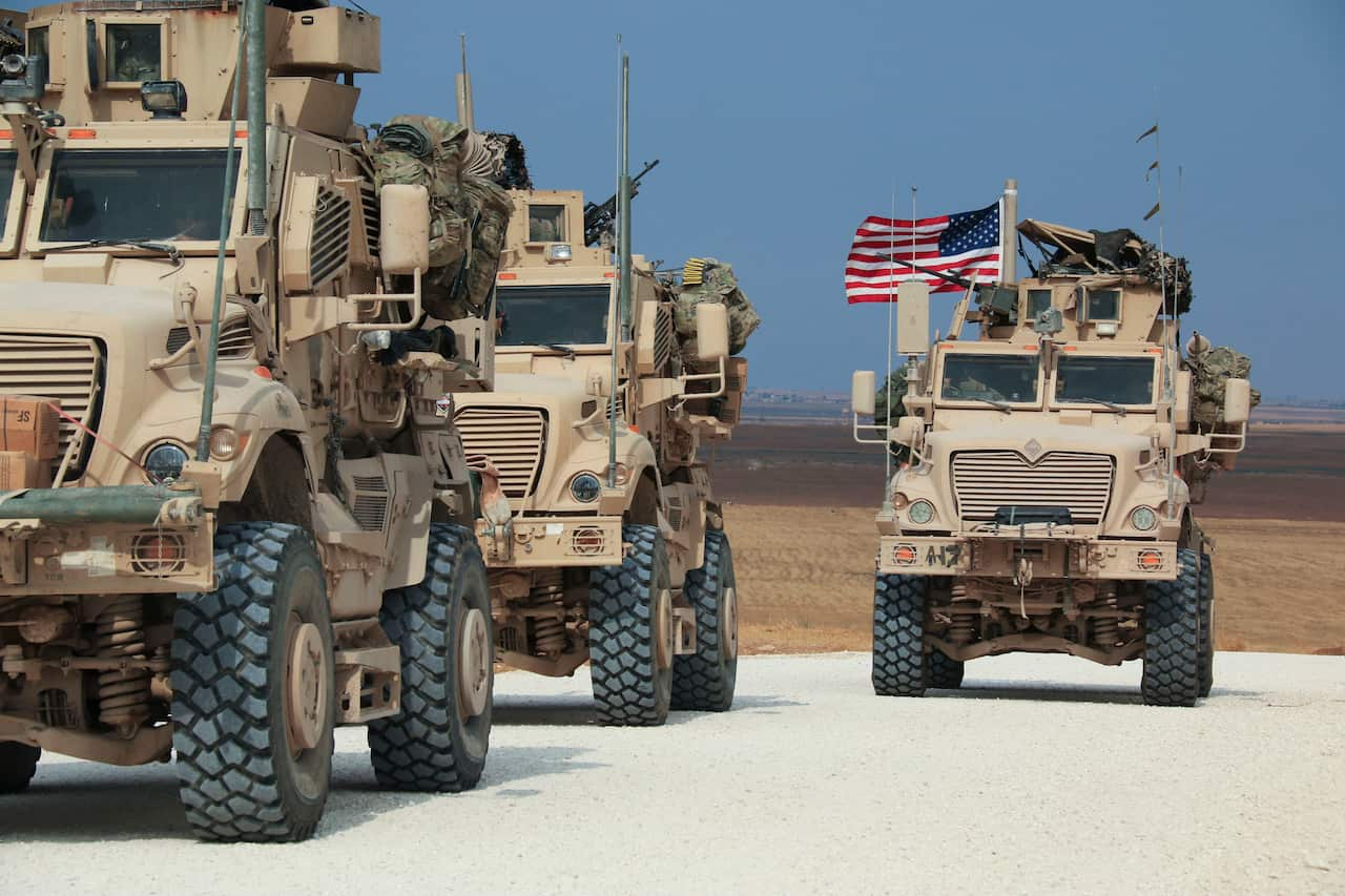 American military convoy stops near the town of Tel Tamr, north Syria.