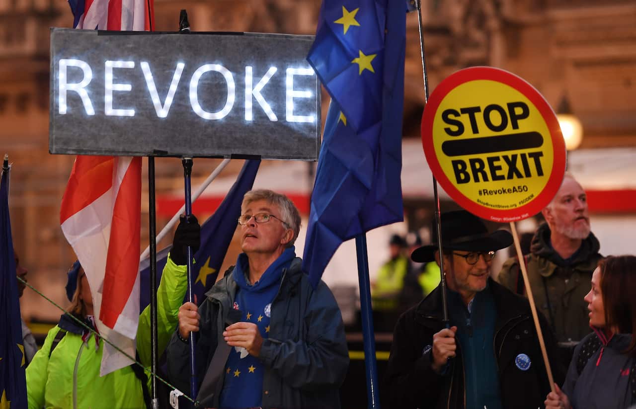 epa07941025 Pro EU campaigners outside Parliament in London, Britain, 22 October 2019. MPs (Members of Parliament) are set to vote on British Prime Minister Boris Johnson's Brexit timetable on 22 October. EPA/ANDY RAIN