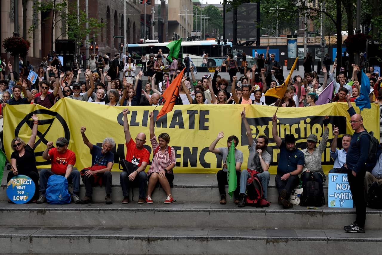 Extinction Rebellion protestors are seen at a rally in Martin Place in Sydney, Friday, October 25, 2019. (AAP Image/Bianca De Marchi) NO ARCHIVING