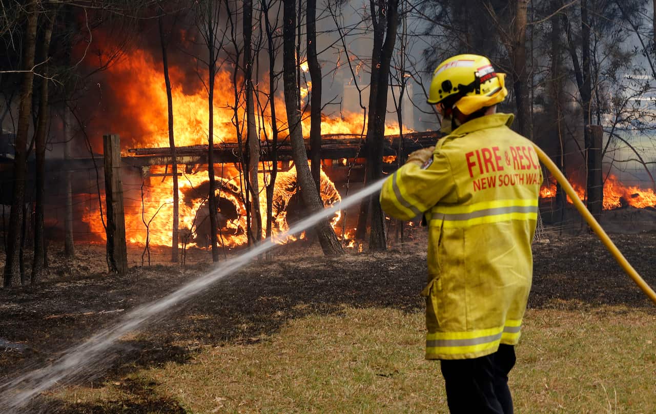 Firefighters battle a blaze at Old Bar on Saturday.