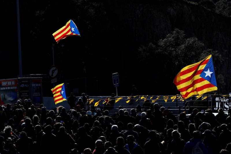 Hundreds of people block the road that connects Spain and France, near the border in Le Perthus, France, 11 November 2019