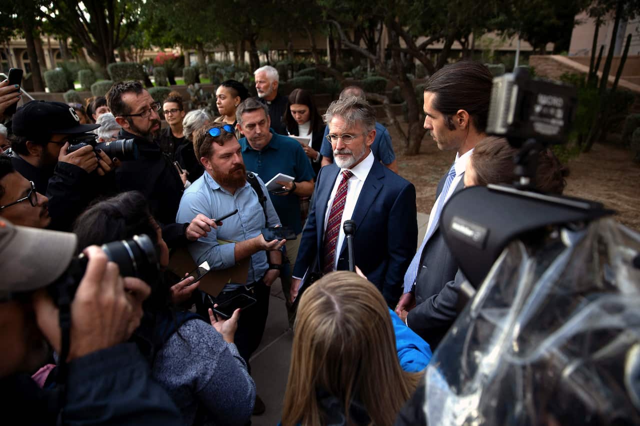 Scott Warren's lawyer Greg Kuykendall talks with media.