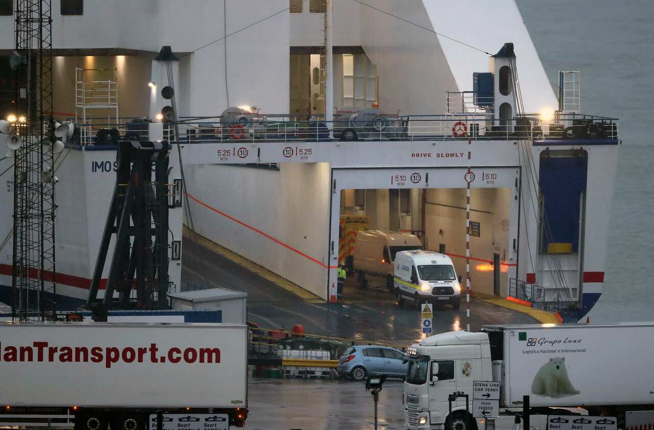 Authorities are seen onboard a Stena Line ferry after 16 people were discovered in a sealed trailer.