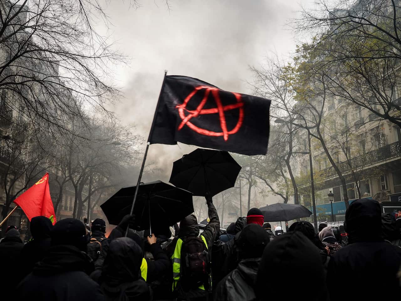 Protesters take part in a demonstration against the pensions overhauls in Paris, France.