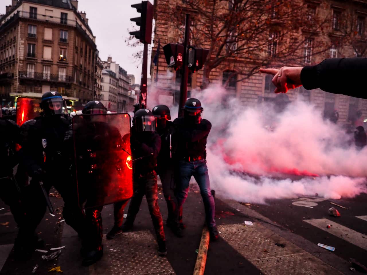 Police face off against protesters.