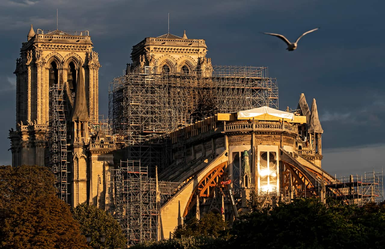 Early morning sunlight shines upon Notre-Dame Cathedral in Paris.