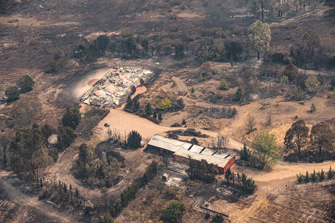 Property damaged by the East Gippsland fires in Sarsfield, Victoria, Wednesday, January 1, 2019. More than half a million hectares have been burnt in Victoria's destructive East Gippsland fires. (AAP Image/News Corp Pool, Jason Edwards) NO ARCHIVING