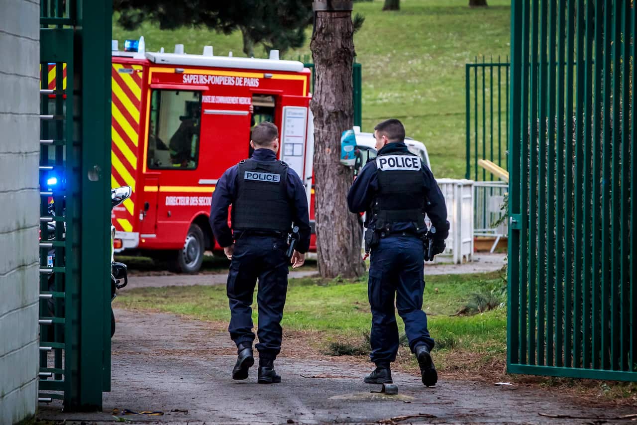 French police at a security perimeter at the Hautes-Bruyeres public park in Villejuif, near Paris.