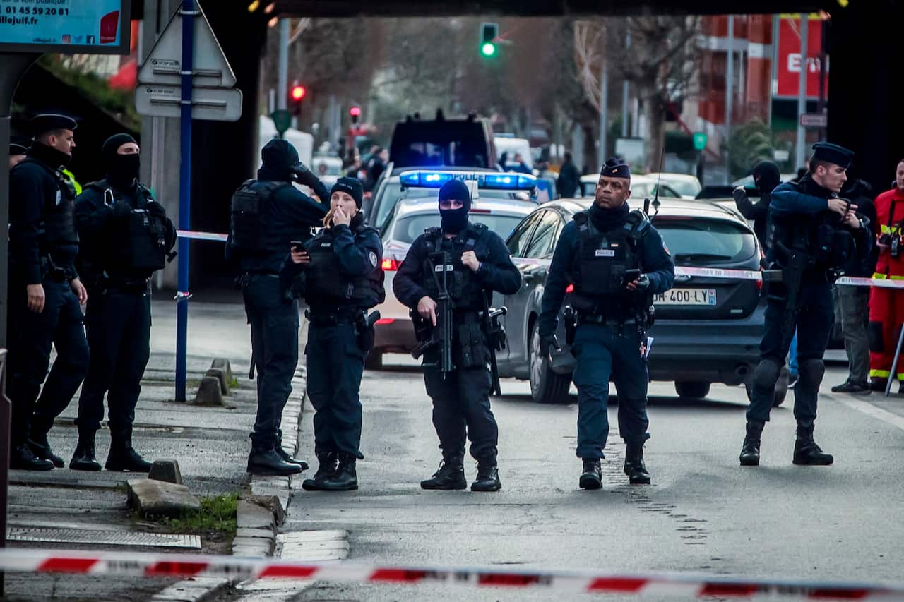 French police at a security perimeter at the Hautes-Bruyeres public park in Villejuif, near Paris.