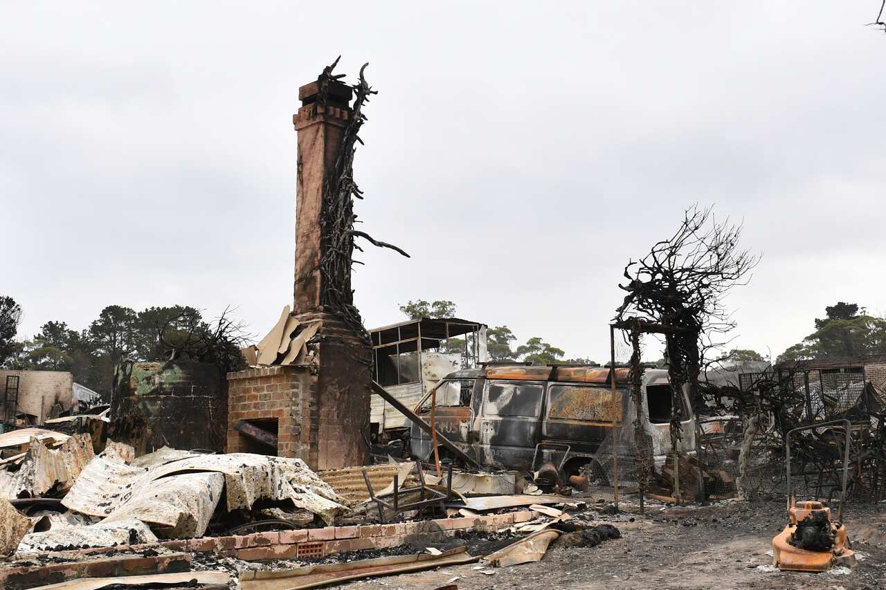 The burnt out remains of a house is seen from a bushfire in the Southern Highlands town of Wingello, 160km south west of Sydney.