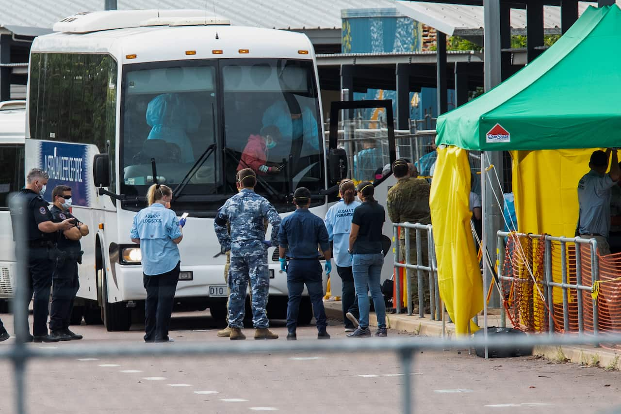 Evacuees from the coronavirus-struck cruise ship Diamond Princess meet with authorities after returning to Australia.