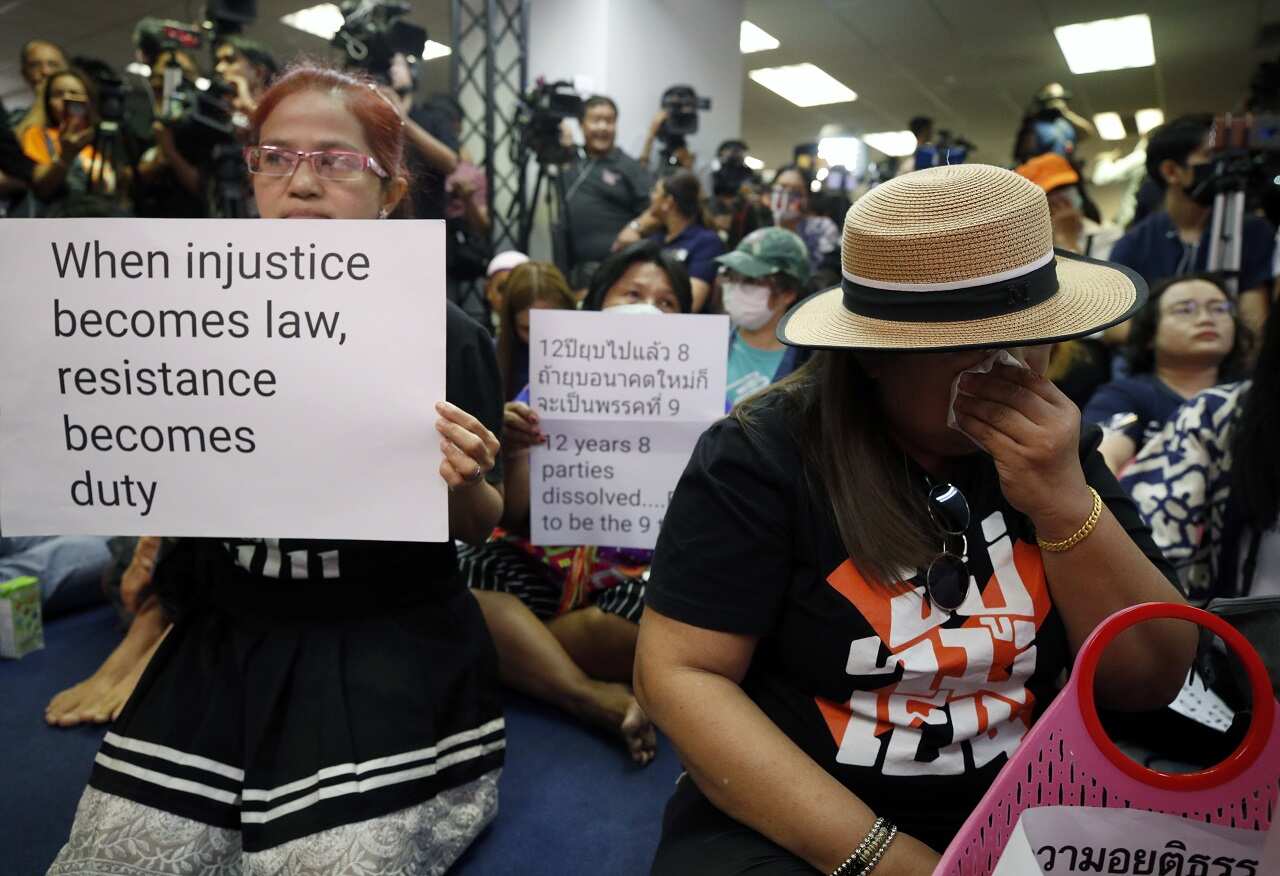 Supporters of the Future Forward Party react after Constitutional Court a ruling.