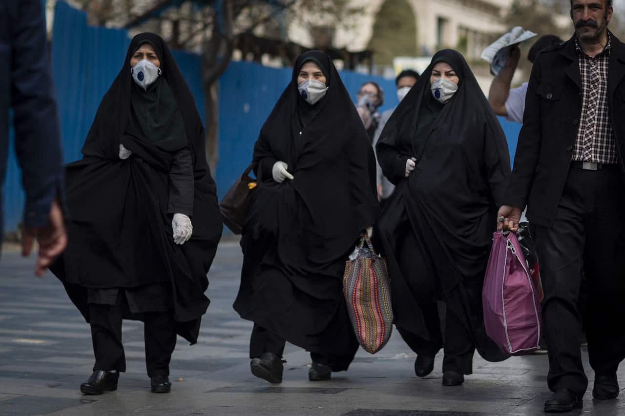 Iranians, some wearing protective masks,walk outside in Tehran, during the Covid-19 coronavirus pandemic crises, on March 17, 2020 in Tehran, Iran. Photo by Ali Shaeigan/Parspix/ABACAPRESS.COM.