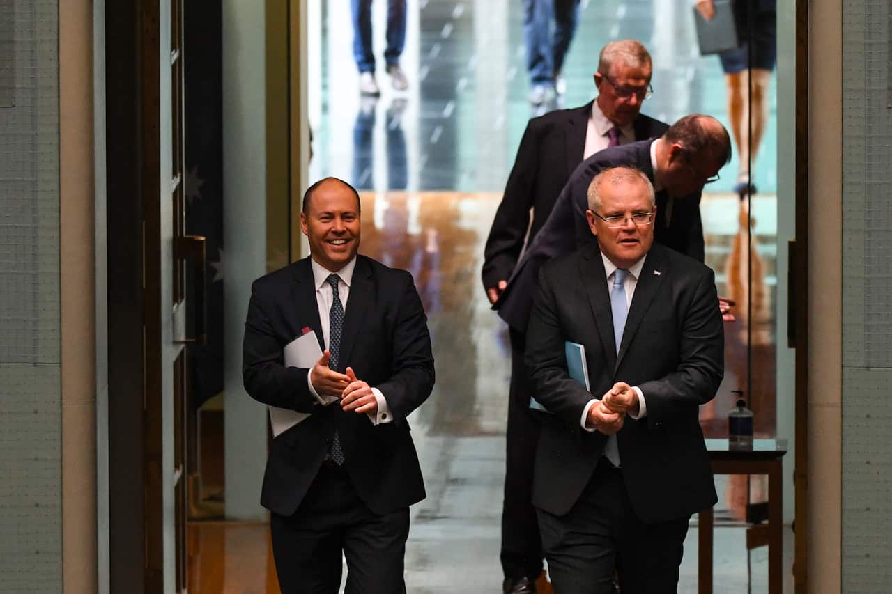 Scott Morrison and Josh Frydenberg practising hand washing protocols. 