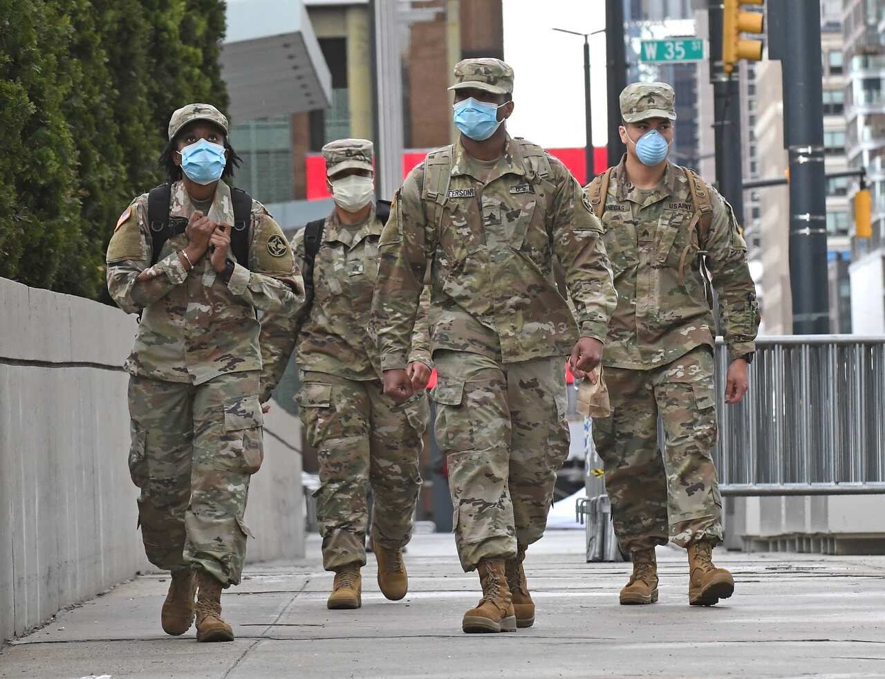 US Military personnel are seen on patrol in New York. The US has now overtaken Spain with 15,774 deaths. 